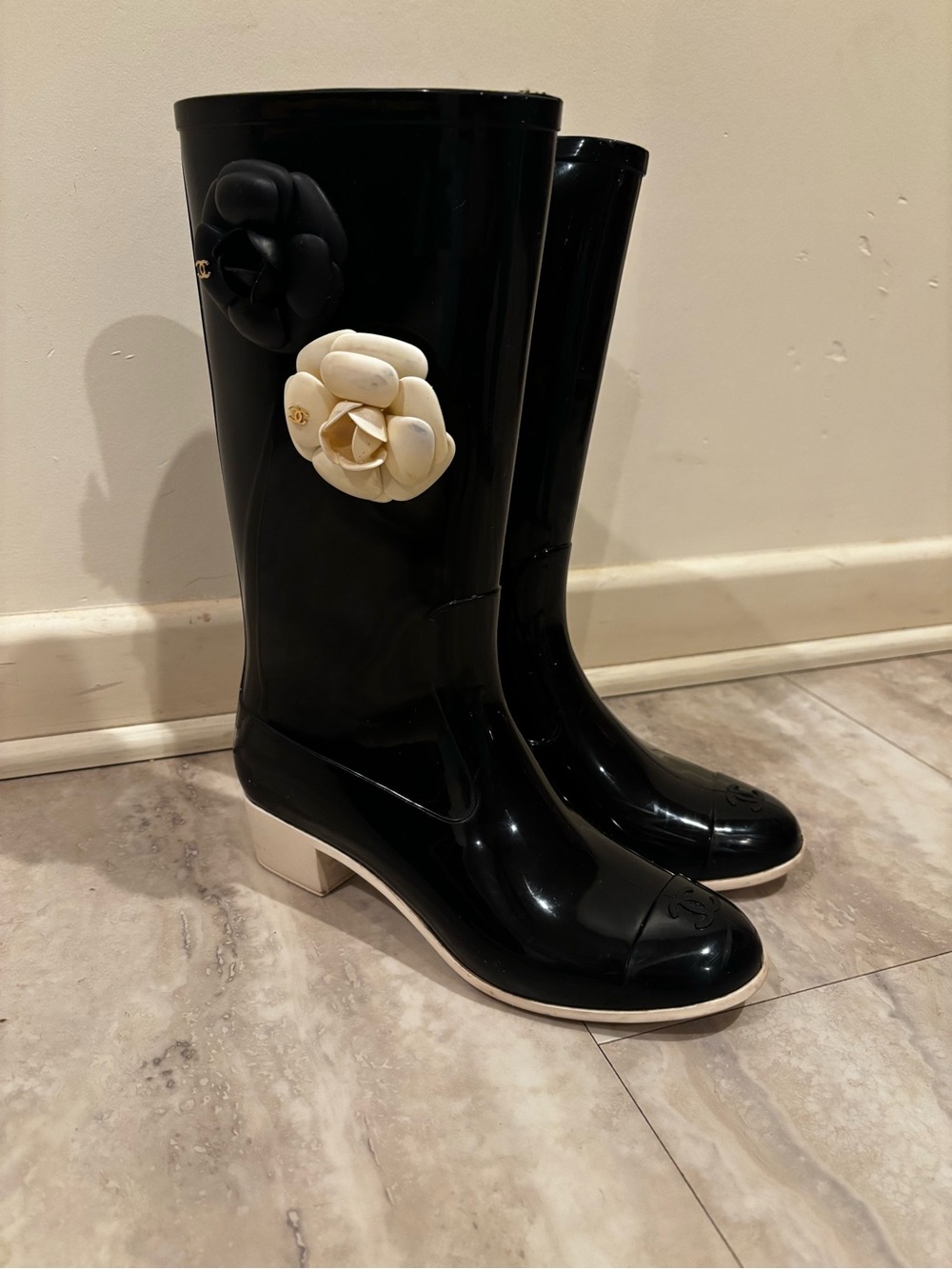 CHANEL Black Rain Boots with White Camellia Accent